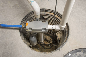 Basement sump pump and basin. Speedy Septic provides sewer ejector pump service in Oregon and Washington.