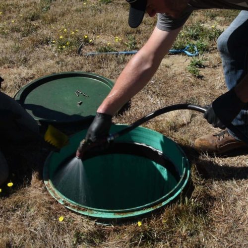 Spraying septic tank for evaluation