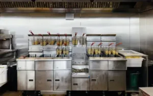 fast food kitchen in portland restaurant with multiple deep fryers